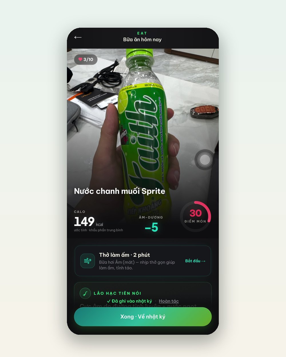 Màn hình Quét của App IKI nhận diện chai nước chanh muối: 149 kcal ước tính, điểm Âm-Dương -5, kèm gợi ý bài thở làm ấm 2 phút